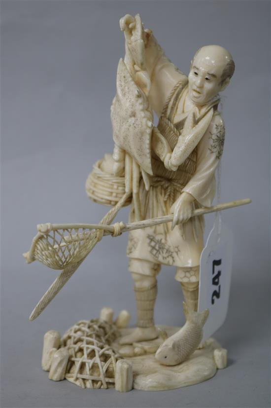 A Japanese ivory okimono of a fisherman